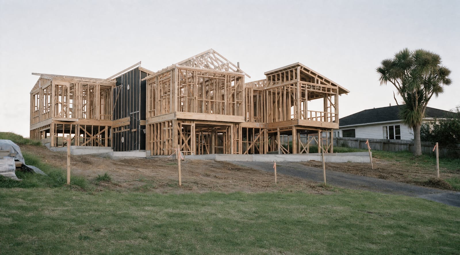 Timber framing and roof trusses standing on the slab